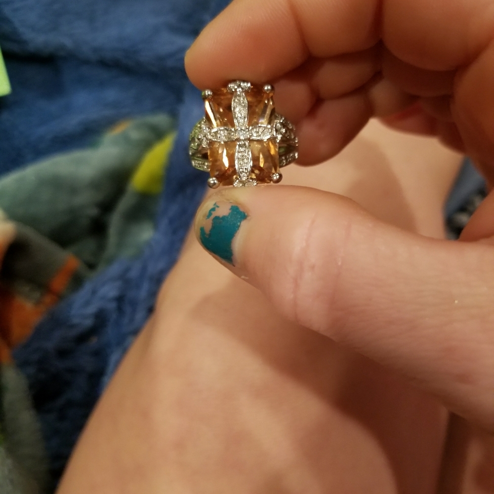 Yellow diamond ring with diamond cross